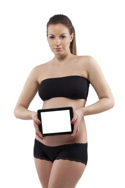 Kvinna med hennes gravid mage. vit bakgrund. — Stockfoto