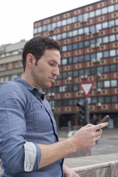 Man typing text message — Stock Photo, Image