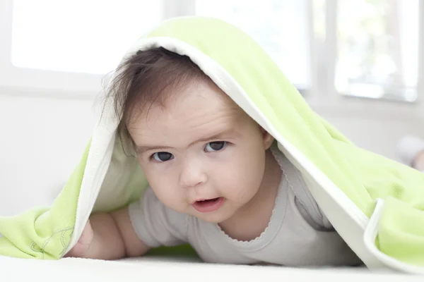 Baby under blanket — Stock Photo, Image