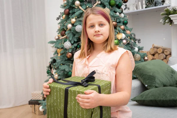 Happy Blonde Girl Holding Christmas Present Christmas Tree Smiling Camera — Stock Photo, Image