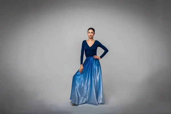 Beautiful Ballerina Stands Looking Straight Camera Long Blue Dress Light — Stock Photo, Image