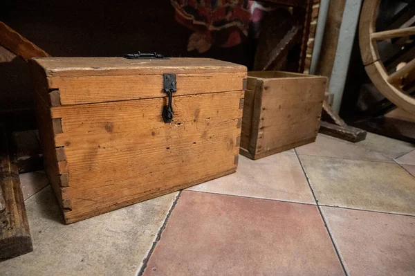 an old wooden box, a wooden product, Ukrainian products, a chest of drawers. Selective focus, slight noise, graininess