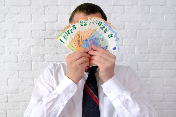 Gerente Cobre Seu Rosto Com Dinheiro — Fotografia de Stock