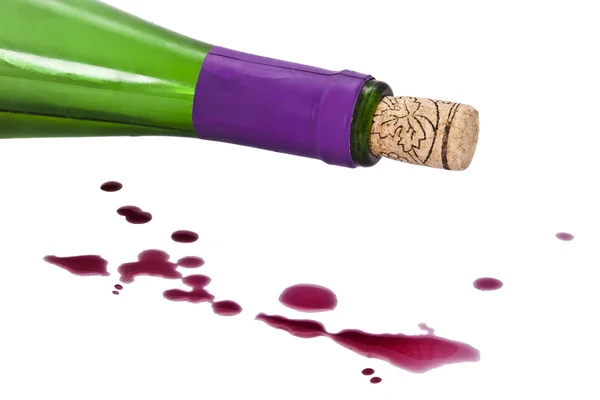 Wine bottle with splashes and drops of wine — Stock Photo, Image