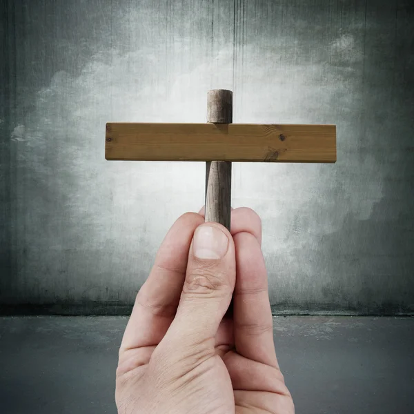 Hand with wooden sign — Stock Photo, Image