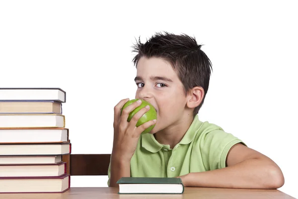 Niño con manzanas y libros en la escuela — Foto de Stock