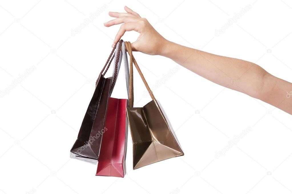 Hands holding shopping bags