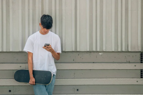Teenage Boy Mobile Phone Skateboard Street — Stock Photo, Image