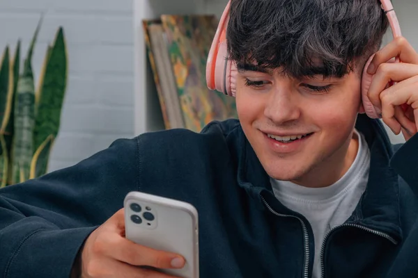 boy with mobile phone and headphones, teenagers