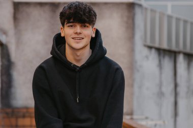 portrait of smiling teenager on the street outdoors