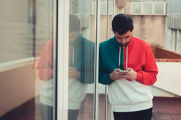 Young Man Mobile Phone Street Colored Sweater — Foto de Stock