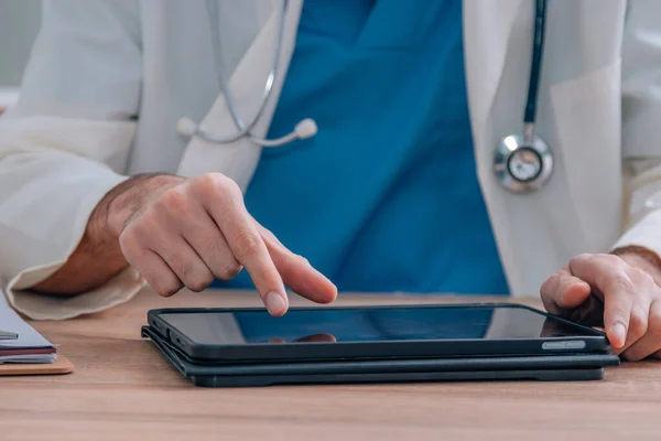 doctor hands with digital screen or tablet