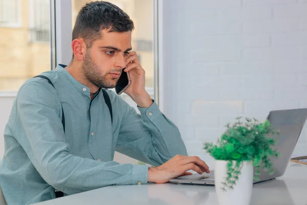 business man with mobile phone and computer