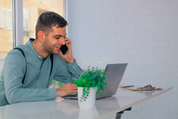 business man with mobile phone and computer