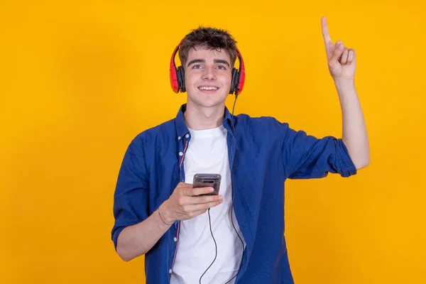 Teenager Headphones Isolated Pointing — Photo