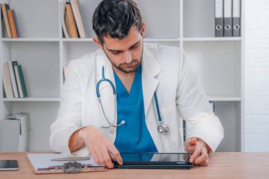 doctor working at clinic desk