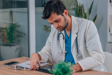 doctor working at clinic desk