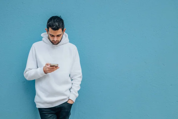 Fashionable Young Man Mobile Phone Blue Street Wall — Foto de Stock