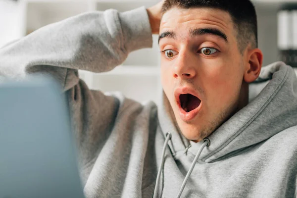 Astonished Young Man Looking Computer — Stock Photo, Image