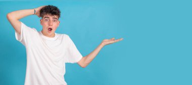 teenage student isolated on background pointing