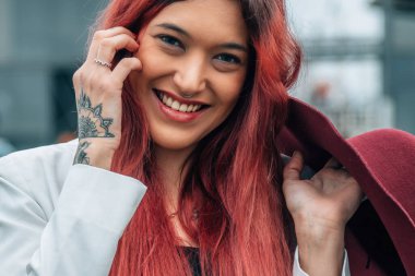 portrait of red-haired girl with hat