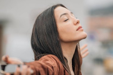 girl breathing relaxed outdoors
