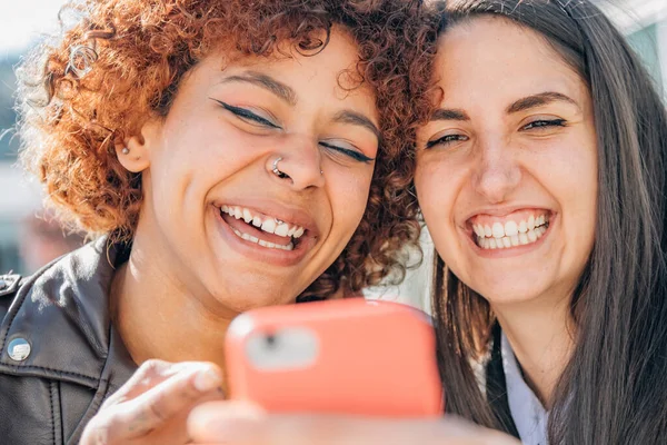Smiling Girls Looking Mobile Phone Street — Fotografia de Stock