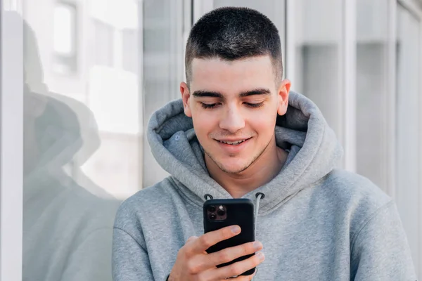 Teen Boy Looking Mobile Phone Smartphone Street — Zdjęcie stockowe