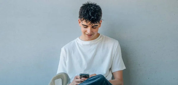 Teenager Sitting Street Mobile Phone — Stockfoto