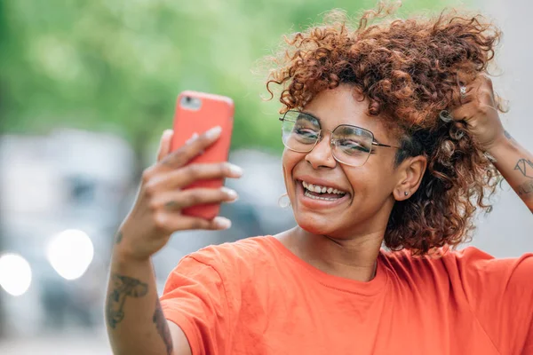 Smiling African American Girl Taking Photo Recording Mobile Phone — Fotografia de Stock