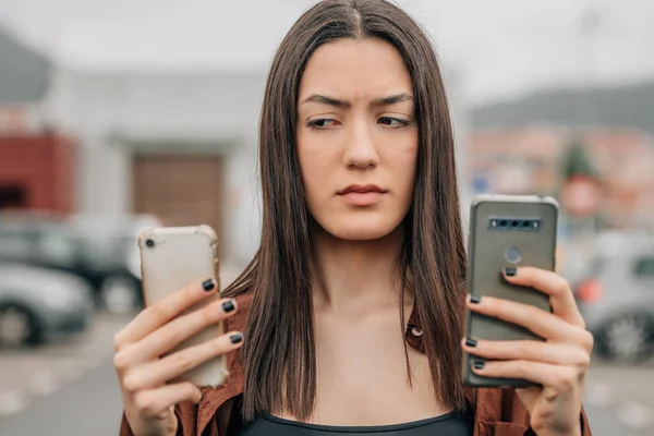 Distrustful Girl Looking Mobile Phone — Fotografia de Stock