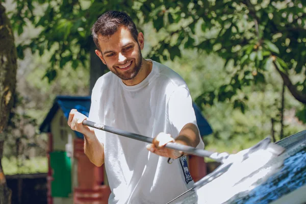 Young Man Washing Car Summer Outdoors — Stockfoto