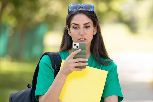 Surprised Student Looking Mobile Phone — Zdjęcie stockowe