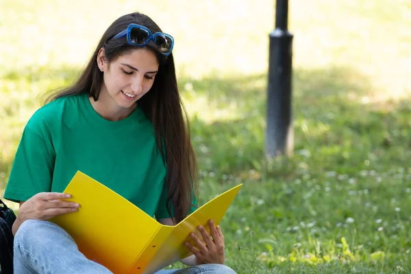 student on campus in summer studying