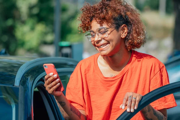 girl in the car with mobile phone