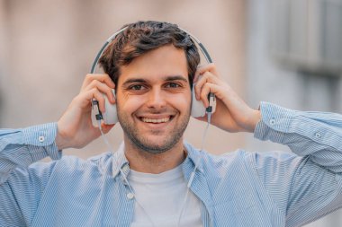 portrait of man in the street with headphones