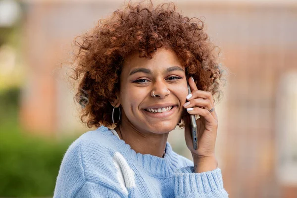 girl on the street talking on mobile phone