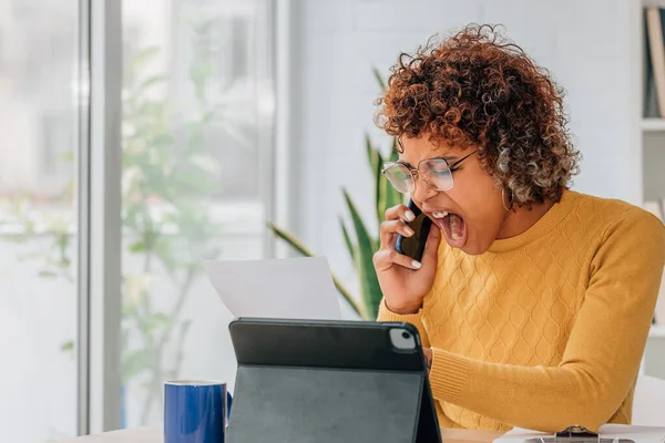 angry young woman claiming the bill by phone