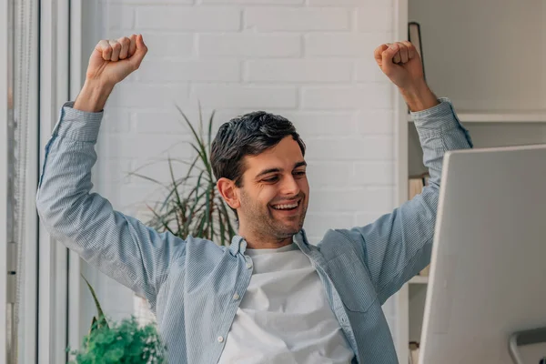 Young Man Home Celebrating Success Looking Computer — Photo