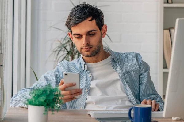 Young Man Home Working Mobile Phone Computer — Stock fotografie