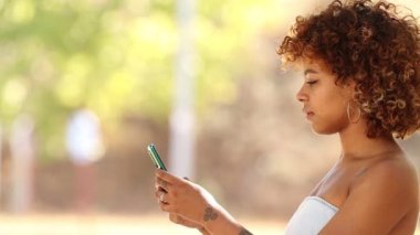 girl with mobile phone and expression of success