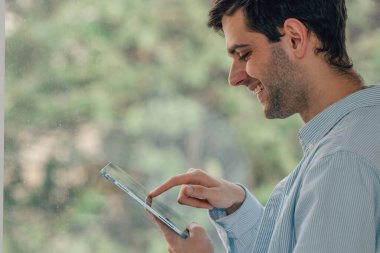 freelance man at home or office with digital tablet