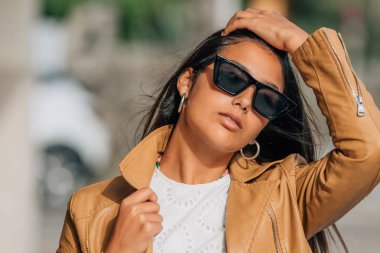 portrait of latina hispanic american girl with sunglasses