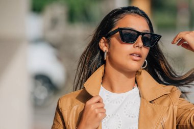 portrait of latina hispanic american girl with sunglasses