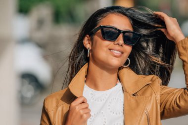 portrait of latina hispanic american girl with sunglasses