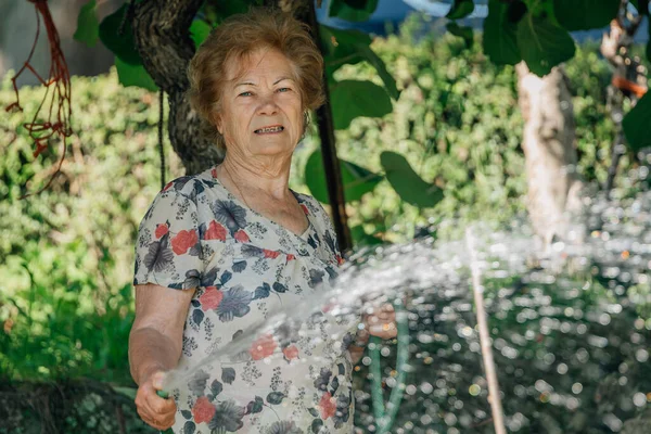 Senior Woman Summer Watering Vegetable Garden — Stock Fotó