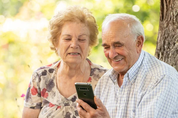 senior couple with mobile phone