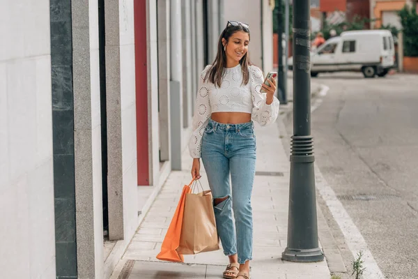 Young Girl Shopping Bags Mobile Phone — ストック写真