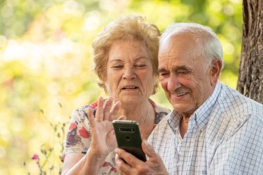 senior couple with mobile phone