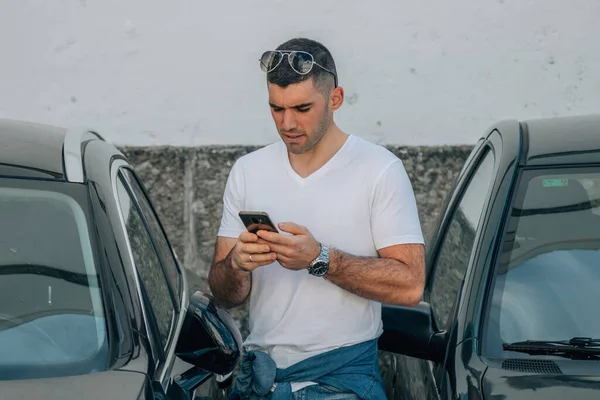 man buying car with mobile phone